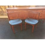 A Nathan teak dining room group sideboard, four chairs and round table.