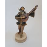 Art Deco gold painted figure clown/ Pierrot playing a lute on alabaster base