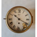 A Smith Eight Day brass cased round ship’s clock
