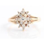 A hallmarked 9ct yellow gold diamond cluster ring, set with three tiers of round brilliant cut