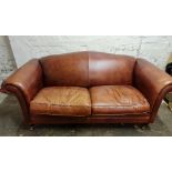 A Laura Ashley brown leather two seater sofa with scrolled arms. IMPORTANT: Online viewing and