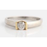 A hallmarked 18ct white gold diamond solitaire ring, bar set with a round brilliant cut diamond,