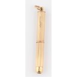 A hallmarked 9ct yellow gold propelling cigar piercer, machined to body, length approx. 4.5cm.