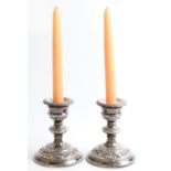 A pair of silver weighted candlestick holders, with removable sconces, hallmarked Birmingham 1979,