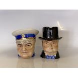 Two large caricature jugs of Sir Winston Churchill with inscription on the base “Never was so much
