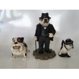 Three Sir Winston Churchill caricature Bulldogs, to include one standing on a plinth with a