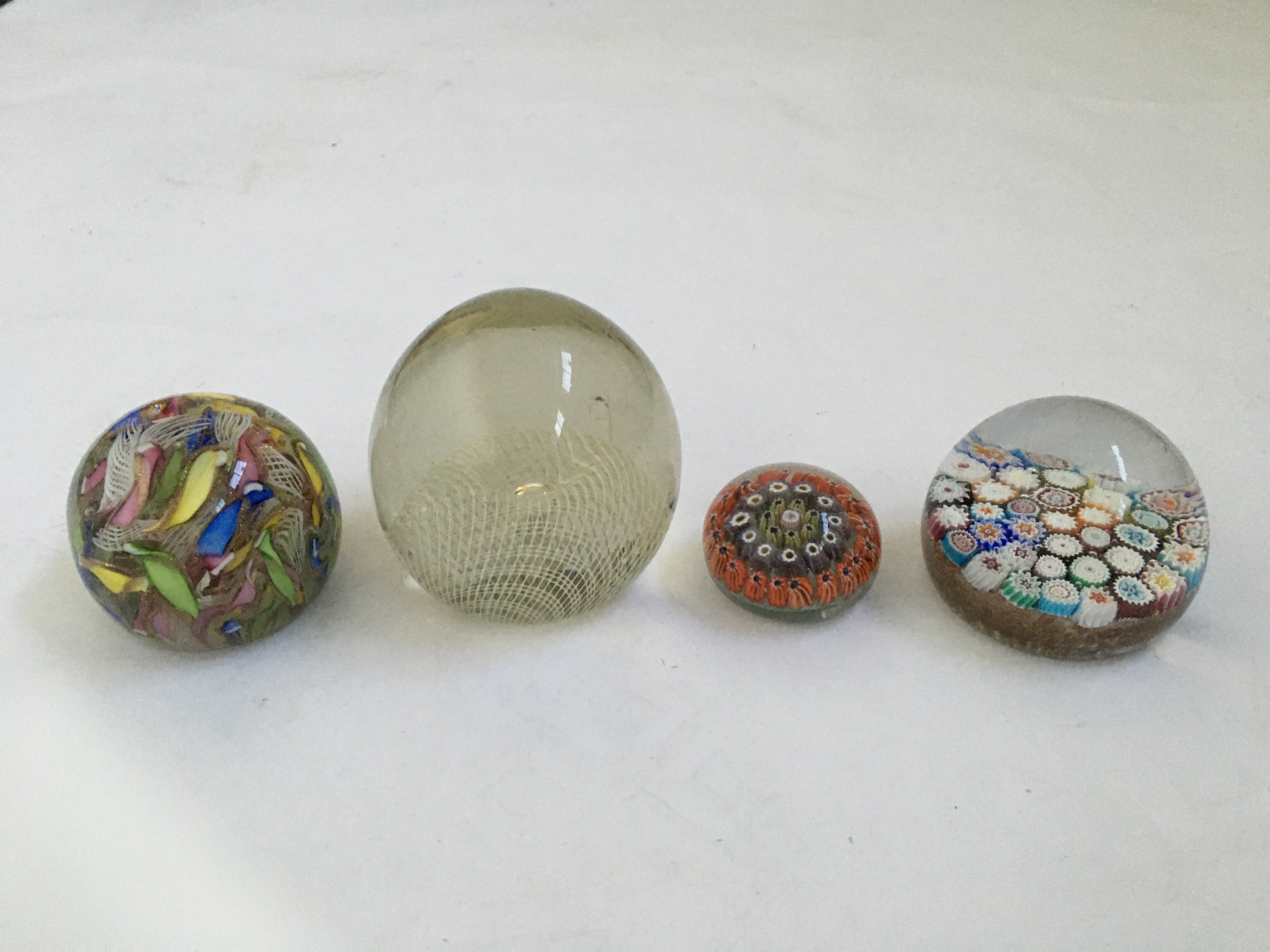 Four various paperweights, to include two Millefeuille. BOOK A VIEWING TIME SLOT ON OUR WEBSITE
