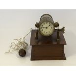 An Edwardian Brass and Mahogany cased night projection clock. BOOK A VIEWING TIME SLOT ON OUR