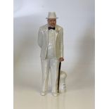 Standing figure of Winston Churchill in white suit and hat black bow tie pink flower in buttonhole