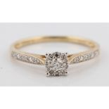 A hallmarked 9ct yellow gold diamond ring, set with a central round brilliant cut diamond, measuring