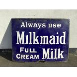 An old original blue and white enamel advertising sign, ‘always use Milkmaid full cream milk’,