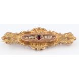 A 9ct yellow gold red stone and seed pearl set brooch, hallmarked Chester, date possibly 1901,
