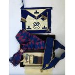 A collection of Masonic related items in brown leather case to include an apron, medals, a