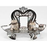 An Empire Plate Art Noveau desk stand housing two inkwells, (A/F). BOOK A VIEWING TIME SLOT ON OUR
