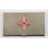 A silver and enamel card holder, featuring central quatrefoil pink enamelled motif with pink stone
