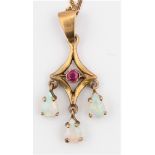 An Edwardian style 9ct yellow gold ruby (possibly synthetic) and opal pendant, the open metalwork