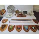 Three swagger sticks, a large quantity of military crested shields, and military pewter figurines,