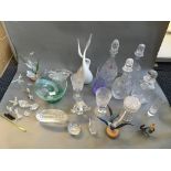 A collection of glassware to include decanters, goblets, and sculptures of various different