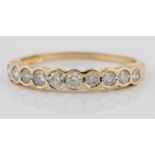 A diamond half eternity ring, bezel set with ten round brilliant cut diamonds, total diamond