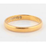 A hallmarked 22ct yellow gold wedding band, ring size K½, approx. weight 2.2g. BOOK A VIEWING TIME