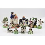 Nine Staffordshire ornaments to include 'Farewell', house, girl and lamb, showman, sheep, cow, three