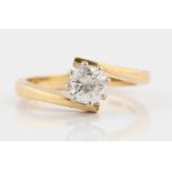 A hallmarked 18ct yellow gold diamond solitaire ring, set with a round brilliant cut diamond,