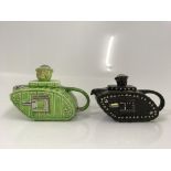 Two teapots, one green and one black, in the shape of a First World War tank with what is believed