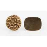 A single 1970s style textured design cufflink, stamped 14k, together with a single gold plated