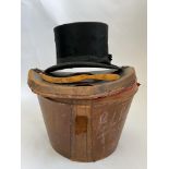 A Bliss’s black top hat in leather case.