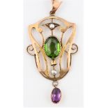 A Suffragette pendant, set with green garnet, amethyst dropper and seed pearl accents, within Art