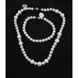 A string of alternately sized cultured pearls, clasp stamped 375, length approx. 15", together