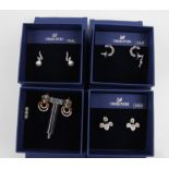 SWAROVSKI. Four sets of Swarovski earrings of various designs, all boxed. 5390189, 5410976, 5290188,