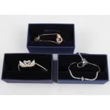 SWAROVSKI. Three Swarovski bracelets/bangles of various designs, all boxed. 5256264, 5290162,