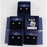 SWAROVSKI. Five pairs of Swarovski earrings of various designs, most boxed. 1179751, 1081941,