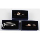 SWAROVSKI. Three Swarovski bracelets/bangles of various designs, all boxed. 5142752, 5200561,