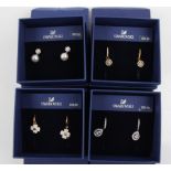 SWAROVSKI. Four sets of Swarovski earrings of various designs, all boxed. 1106454, 5197458, 5290963,