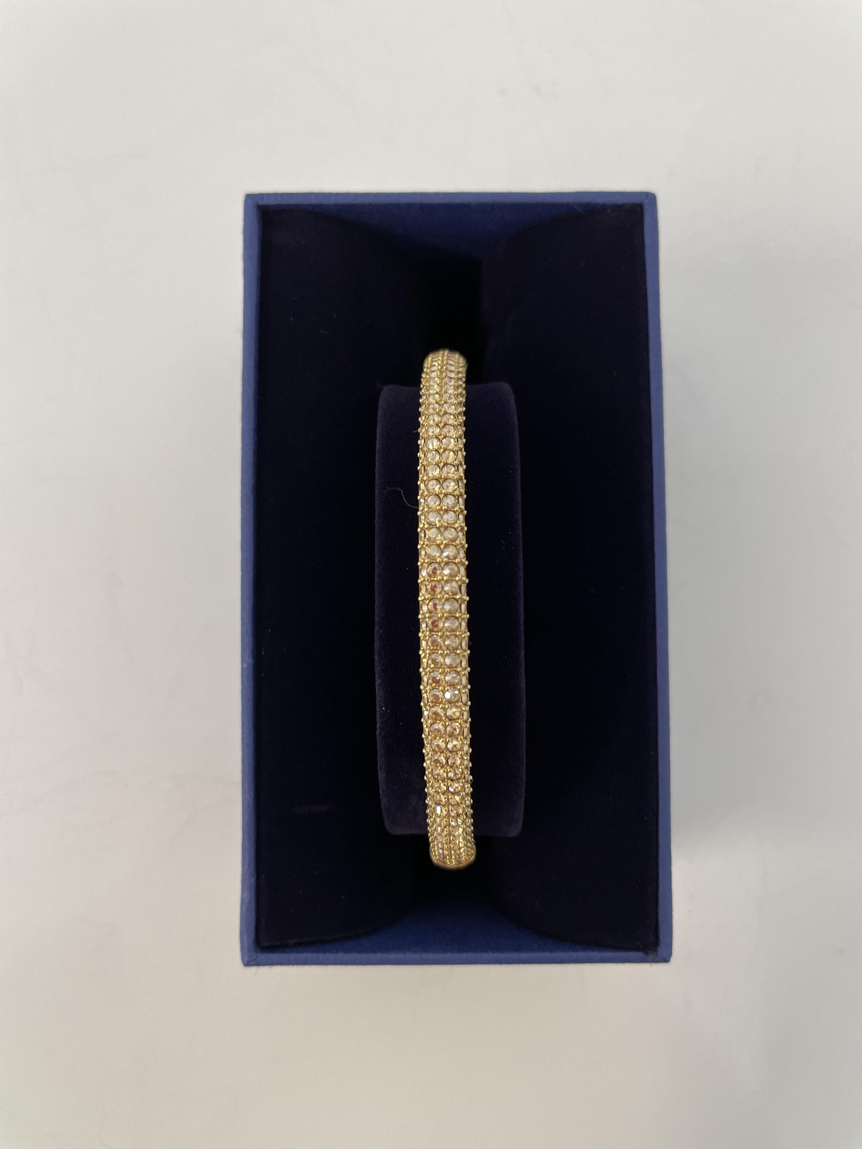 SWAROVSKI. A Swarovski bangle, boxed, 5032848. IMPORTANT: Bidding via the-saleroom.com ONLY. In-