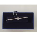 SWAROVSKI. Swarovski bracelet/bangle of crescent moon design, boxed. 5349627. IMPORTANT: Bidding via