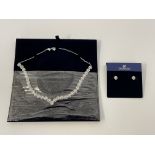 SWAROVSKI. A Swarovski necklet and earring set, boxed. 5364318. IMPORTANT: Bidding via the-