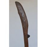 A 19th century African war club with flat head and nodule to side.