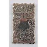 A Victorian silver card case, engraved with scrolling foliage design and blank central cartouche,