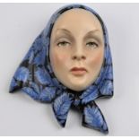 A Lenci by Helen Konig ceramic mask with blue and black headscarf