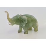 A Chinese jade / jadeite carved figure of an elephant.