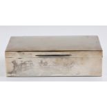 A hallmarked silver cigarette box, with engraved signatures to lid, approx. width 18cm.