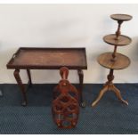 A bamboo and leaf decorated folding table together with a bottle shaped wine holder and three tiered