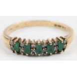 A hallmarked 9ct yellow gold emerald and diamond half eternity ring, set with five rectangular cut