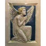 A Della Robbia ceramic plaque of a praying angel. Ship stamped to back with letters DR.