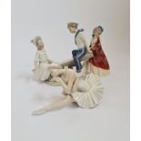 Two Lladro figurines, one of a ballerina, other of a girl and boy on see-saw.