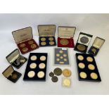 A collection of gold and bronze coloured Sir Winston Churchill themed coins.