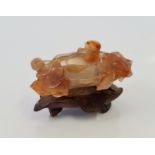 A Chinese agate miniature hand carved bowl with leaf design.